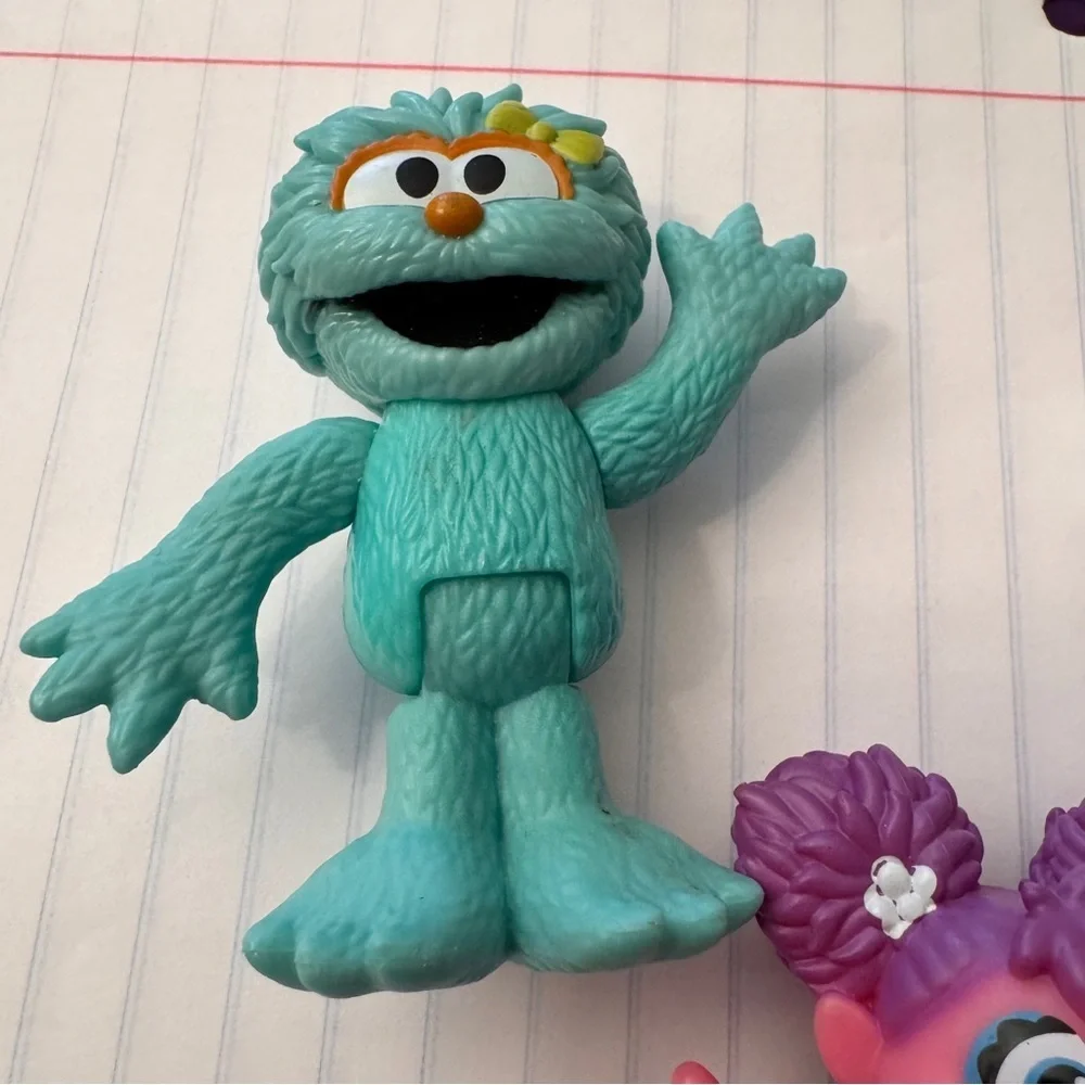 Colorful Sesame Street Neighborhood Friends and Minnie Mouse figurines